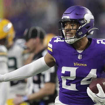 Dec 29, 2024; Minneapolis, Minnesota, USA; Minnesota Vikings safety Camryn Bynum (24) celebrates recovering a fumble by Green Bay Packers running back Josh Jacobs (8) in the first quarter at U.S. Bank Stadium. Mandatory Credit: Dan Powers/USA TODAY NETWORK-Wisconsin via Imagn Images