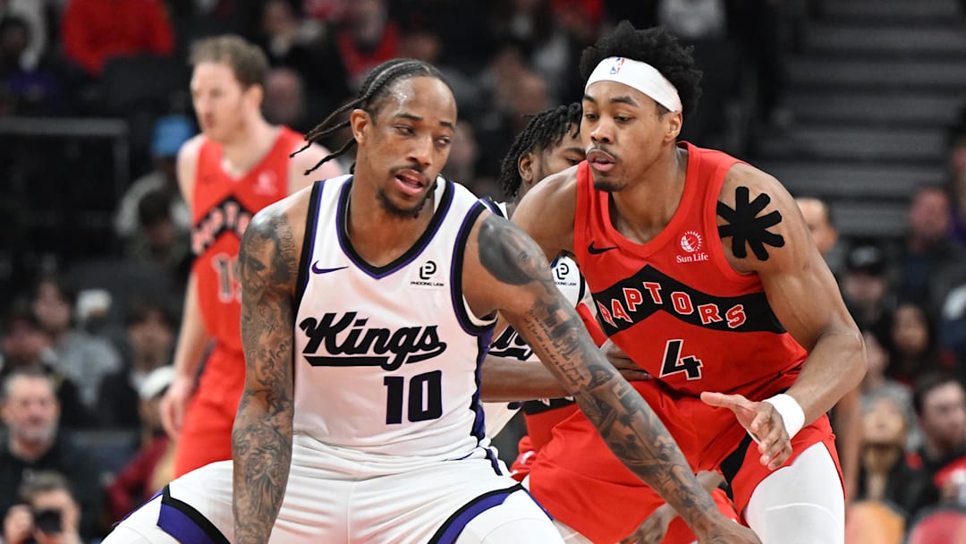Apr 1, 2026; Toronto, Ontario, CAN;  Sacramento Kings forward DeMar DeRozan (10) dribbles the ball as Toronto Raptors forward Scottie Barnes (4) defends in the second half at Scotiabank Arena.