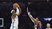 Nov 12, 2025; Oklahoma City, Oklahoma, USA; Oklahoma City Thunder guard Shai Gilgeous-Alexander (2) shoots over Los Angeles Lakers guard Marcus Smart (36) during the second quarter at Paycom Center. Mandatory Credit: Alonzo Adams-Imagn Images