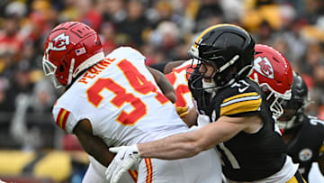 Dec 25, 2024; Pittsburgh, Pennsylvania, USA; Pittsburgh Steelers linebacker Payton Wilson (41) tackles Kansas City Chiefs running back Samaje Perine (34) during the second quarter at Acrisure Stadium. Mandatory Credit: Barry Reeger-Imagn Images