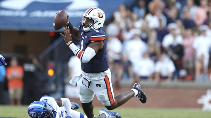 Sep 25, 2021; Auburn, Alabama, USA; Georgia State Panthers linebacker Shamar McCollum (17) knocks Auburn Tigers quarterback TJ Finley (1) off balance during the fourth quarter at Jordan-Hare Stadium.  Finley completed the pass to keep the go ahead drive alive. Mandatory Credit: John Reed-Imagn Images