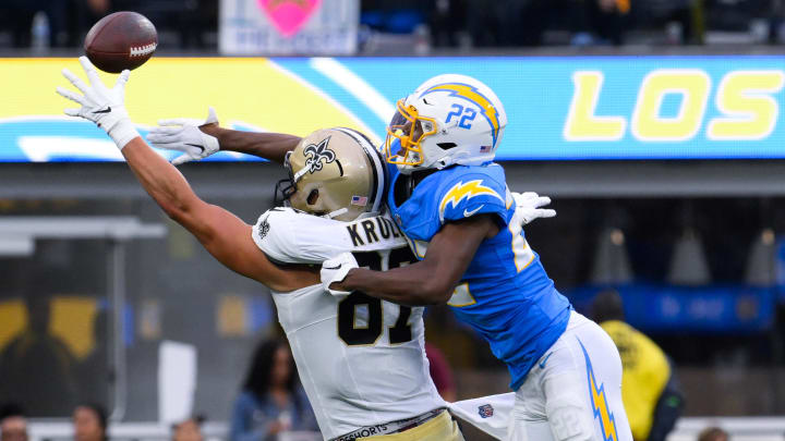 Los Angeles Chargers safety JT Woods (22) against New Orleans Saints tight end Lucas Krull (87).