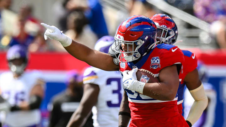 Sep 8, 2024; East Rutherford, New Jersey, USA; New York Giants linebacker Darius Muasau (53) reacts after an interception against the Minnesota Vikings during the second half at MetLife Stadium.  