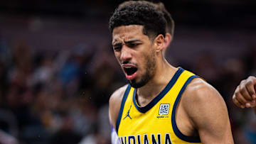 Apr 4, 2025; Indianapolis, Indiana, USA; Indiana Pacers guard Tyrese Haliburton (0) reacts to a basket and foul in the second half against the Utah Jazz at Gainbridge Fieldhouse. Mandatory Credit: Trevor Ruszkowski-Imagn Images