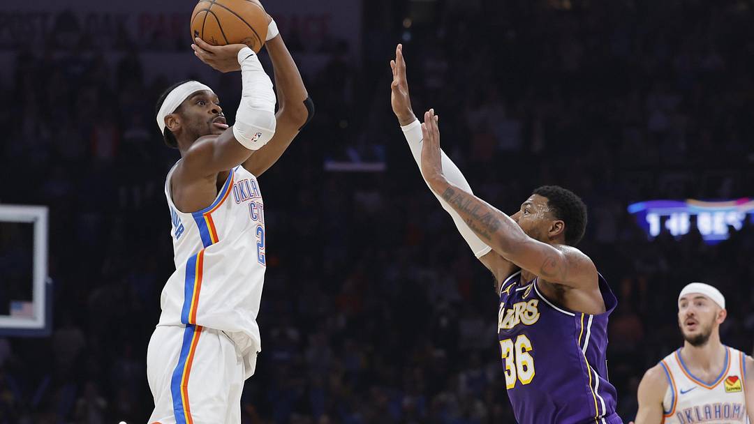 Nov 12, 2025; Oklahoma City, Oklahoma, USA; Oklahoma City Thunder guard Shai Gilgeous-Alexander (2) shoots over Los Angeles Lakers guard Marcus Smart (36) during the second quarter at Paycom Center.