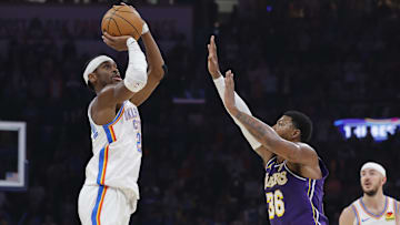 Nov 12, 2025; Oklahoma City, Oklahoma, USA; Oklahoma City Thunder guard Shai Gilgeous-Alexander (2) shoots over Los Angeles Lakers guard Marcus Smart (36) during the second quarter at Paycom Center. Mandatory Credit: Alonzo Adams-Imagn Images