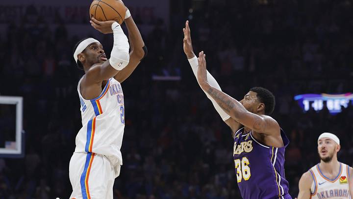 Nov 12, 2025; Oklahoma City, Oklahoma, USA; Oklahoma City Thunder guard Shai Gilgeous-Alexander (2) shoots over Los Angeles Lakers guard Marcus Smart (36) during the second quarter at Paycom Center. Mandatory Credit: Alonzo Adams-Imagn Images