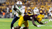 Nov 28, 2025; Tempe, Arizona, USA; Arizona Wildcats defensive back Treydan Stukes (2) intercepts the ball against Arizona State Sun Devils wide receiver Jaren Hamilton (16) in the second half during the 99th Territorial Cup at Mountain America Stadium. Mandatory Credit: Mark J. Rebilas-Imagn Images