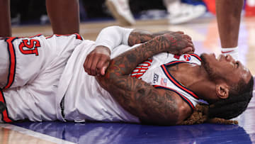 Jan 11, 2025; New York, New York, USA;  St. John's basketball guard Deivon Smith (5) reacts after suffering an apparent injury to his shoulder in the first half against the Villanova Wildcats at Madison Square Garden. 