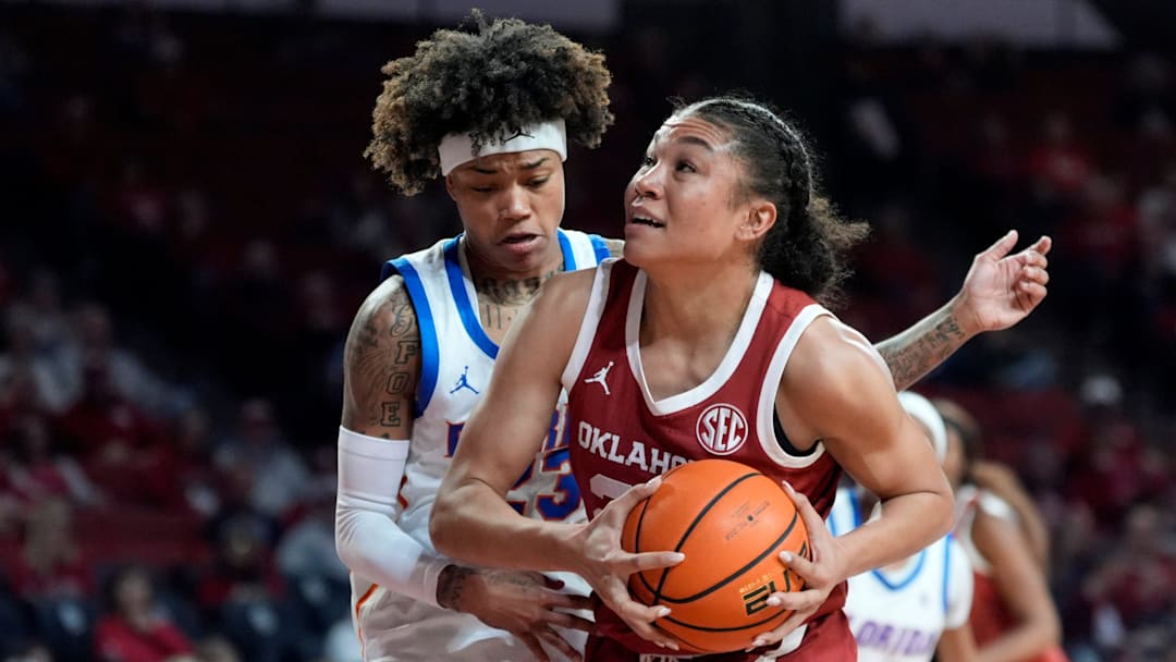 Oklahoma guard Keziah Lofton fights through contact against the Florida Gators.