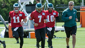 Jun 9, 2016; Philadelphia, PA, USA; Philadelphia Eagles quarterback Carson Wentz (11) and quarterback Sam Bradford (7) and quarterback Chase Daniel (10) and  offensive coordinator Frank Reich (right) during mini camp at NovaCare Complex. Mandatory Credit: Bill Streicher-Imagn Images