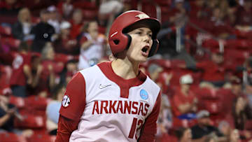 May 18, 2025; Fayetteville, AR, USA; Arkansas Razorbacks pinch runner Kasey Wood (13) celebrates after scoring during the game against the Oklahoma State Cowgirls at Bogle Park. Mandatory Credit: Nelson Chenault-Imagn Images