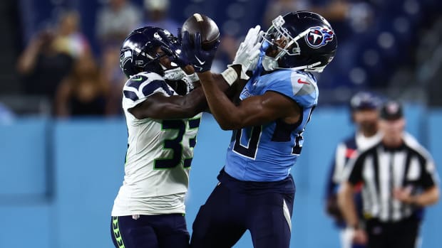 Tennessee Titans wide receiver Bryce Oliver (80) has a catch blocked by Seattle Seahawks wide receiver Dee Williams (33).