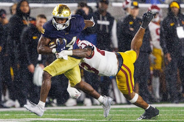 USC linebacker Desman Stephens II tries to tackle Notre Dame running back Jadarian Price.