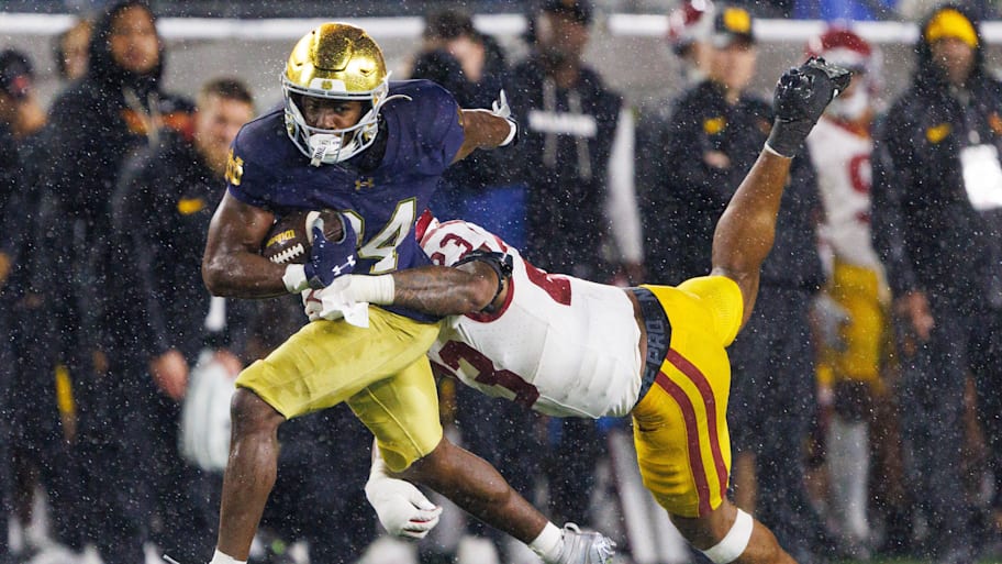 USC linebacker Desman Stephens II tries to tackle Notre Dame running back Jadarian Price.