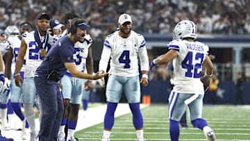 Aug 12, 2023; Arlington, Texas, USA; Dallas Cowboys offensive coordinator  Brian Schottenheimer and quarterback Dak Prescott (4) and running back Deuce Vaughn (42) celebrate a touchdown in the fourth quarter against the Jacksonville Jaguars at AT&T Stadium. Mandatory Credit: Tim Heitman-Imagn Images
