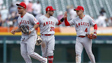 Angels shortstop Jose Iglesias (4) celebrates with second baseman David Fletcher (22) after the game against the Detroit Tigers at Comerica Park on Aug. 19, 2021.