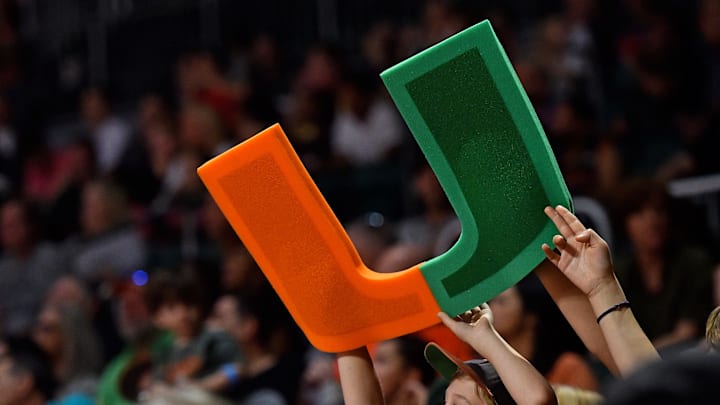 Nov 25, 2017; Coral Gables, FL, USA; A young Miami Hurricanes fan holds up a foam logo during the first half in the game between the Miami Hurricanes and the North Florida Ospreys at Watsco Center. Mandatory Credit: Jasen Vinlove-Imagn Images
