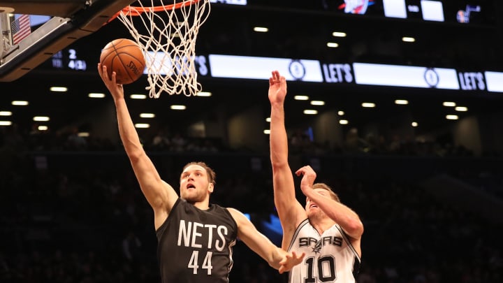 Jan 23, 2017; Brooklyn, NY, USA;  Brooklyn Nets guard Bojan Bogdanovic (44) shoots as San Antonio Spurs forward David Lee (10) defends during the second quarter at Barclays Center. Mandatory Credit: Anthony Gruppuso-USA TODAY Sports
