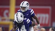 Dec 26, 2024; Phoenix, AZ, USA; Kansas State Wildcats running back Dylan Edwards (3) celebrates a touchdown with teammate Dante Cephas (14) against the Rutgers Scarlet Knights during the second half of the Rate Bowl at Chase Field. Mandatory Credit: Mark J. Rebilas-Imagn Images