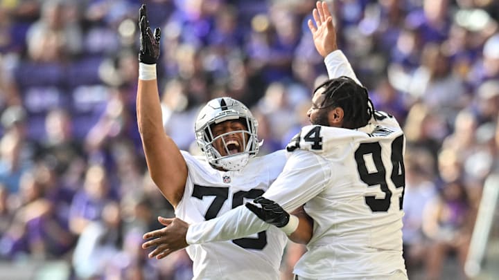 Aug 10, 2024; Minneapolis, Minnesota, USA; Las Vegas Raiders defensive end Ron Stone Jr. (76) and defensive tackle Christian Wilkins (94) react during the game against the Minnesota Vikings at U.S. Bank Stadium. Mandatory Credit: Jeffrey Becker-Imagn Images