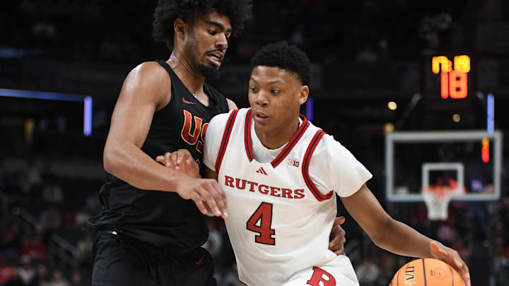 Mar 12, 2025; Indianapolis, IN, USA; Rutgers Scarlet Knights guard Ace Bailey (4) goes to the basket against USC Trojans forward Saint Thomas (0) during the first half at Gainbridge Fieldhouse. Mandatory Credit: Robert Goddin-Imagn Images Mar 12, 2025; Indianapolis, IN, USA; Rutgers Scarlet Knights guard Ace Bailey (4) goes to the basket against USC Trojans forward Saint Thomas (0) during the first half at Gainbridge Fieldhouse. Mandatory Credit: Robert Goddin-Imagn Images