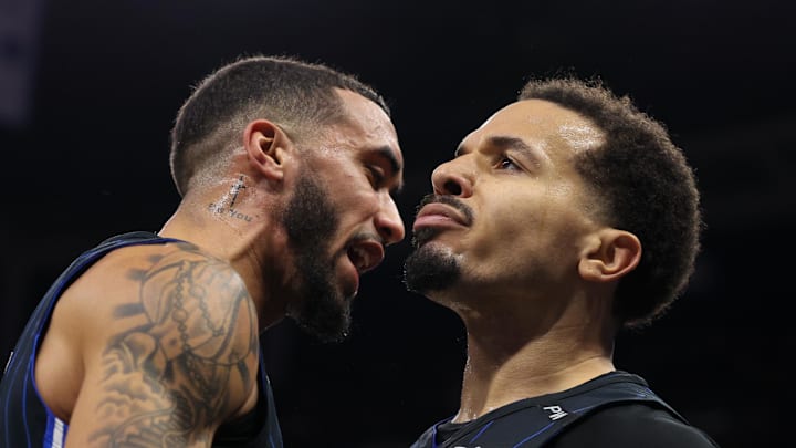 Dec 21, 2024; Orlando, Florida, USA; Orlando Magic guard Trevelin Queen (12) and guard Cole Anthony (50) celebrates after a called foul against the Miami Heat in the fourth quarter at Kia Center. Mandatory Credit: Nathan Ray Seebeck-Imagn Images Dec 21, 2024; Orlando, Florida, USA; Orlando Magic guard Trevelin Queen (12) and guard Cole Anthony (50) celebrates after a called foul against the Miami Heat in the fourth quarter at Kia Center. Mandatory Credit: Nathan Ray Seebeck-Imagn Images