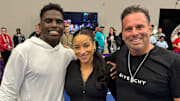 Miami Dolphins' Tyreek Hill poses with wife Keeta Vaccaro and Hollywood director Randall Emmett at the Franklin Pickleball Experience in Las Vegas.