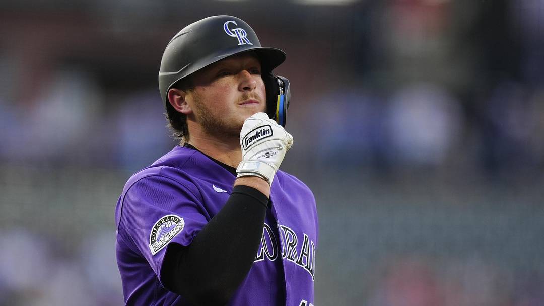 Colorado Rockies catcher Hunter Goodman (15) reacts to his two run home run in the first inning against the Chicago Cubs at Coors Field. 