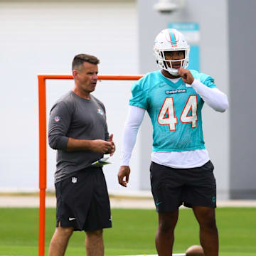 Miami Dolphins linebacker Chop Robinson (44) works out during mandatory minicamp at Baptist Health Training Complex.