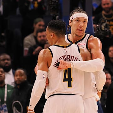 Denver Nuggets guard Russell Westbrook (4) and forward Aaron Gordon (32) hug during the final seconds of the fourth quarter against the Golden State Warriors at Chase Center.