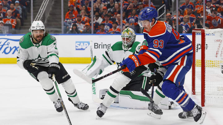 May 27, 2024; Edmonton, Alberta, CAN; Dallas Stars defensemen Chris Tanev (3) and Edmonton Oilers forward Ryan Nugent-Hopkins (93) chase a loose puck during the first period in game three of the Western Conference Final of the 2024 Stanley Cup Playoffs at Rogers Place. Mandatory Credit: Perry Nelson-USA TODAY Sports