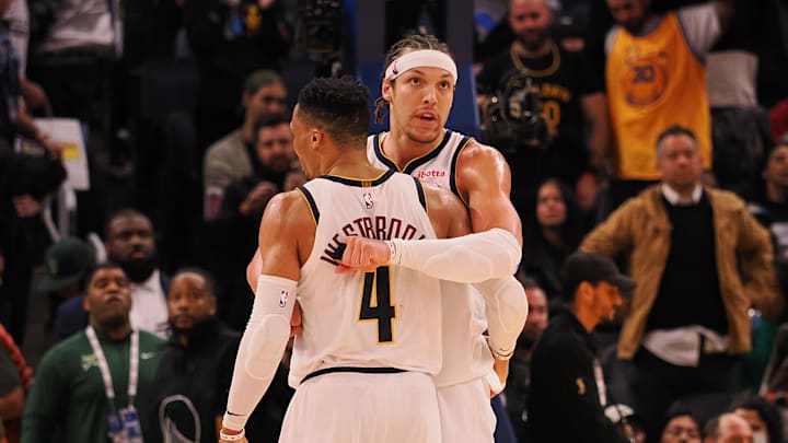 Denver Nuggets guard Russell Westbrook (4) and forward Aaron Gordon (32) hug during the final seconds of the fourth quarter against the Golden State Warriors at Chase Center.
