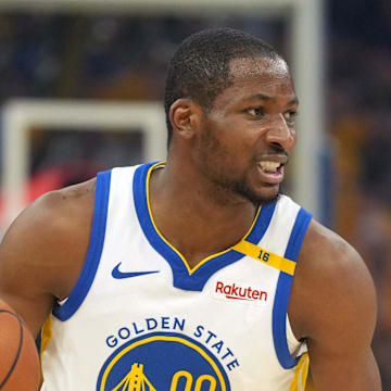 Apr 26, 2025; San Francisco, California, USA; Golden State Warriors forward Jonathan Kuminga (00) dribbles against the Houston Rockets during the first quarter of game three of first round for the 2024 NBA Playoffs at Chase Center. Mandatory Credit: Darren Yamashita-Imagn Images
