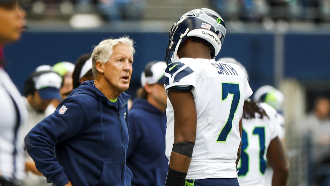 Sep 24, 2023; Seattle, Washington, USA; Seattle Seahawks head coach Pete Carroll talks with QB Geno Smith
