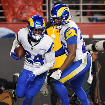 Dec 12, 2024; Santa Clara, California, USA; Los Angeles Rams cornerback Darious Williams (24) reacts with safety Kamren Kinchens (26) after intercepting a pass against the San Francisco 49ers in the fourth quarter at Levi's Stadium. Mandatory Credit: Cary Edmondson-Imagn Images