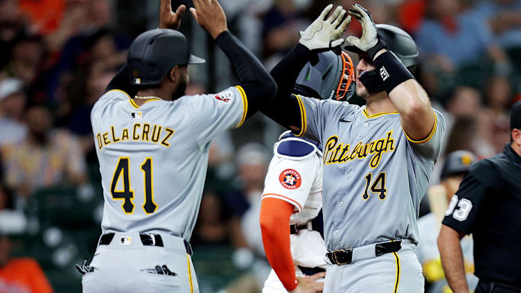 Jul 31, 2024; Houston, Texas, USA; Pittsburgh Pirates catcher Joey Bart (14) is congratulated at home plate by right fielder Bryan De La Cruz (41) after hitting a two-run home run against the Houston Astros during the second inning at Minute Maid Park. Mandatory Credit: Erik Williams-USA TODAY Sports