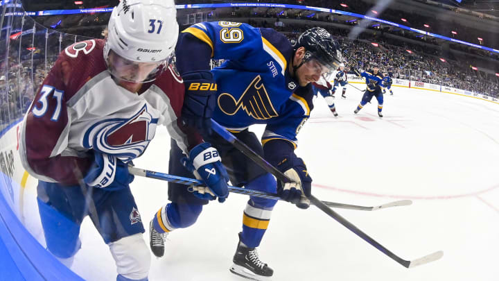 Mar 19, 2024; St. Louis, Missouri, USA;  Colorado Avalanche center Casey Mittelstadt (37) and St. Louis Blues left wing Pavel Buchnevich (89) battle for the puck during the second period at Enterprise Center. Mandatory Credit: Jeff Curry-USA TODAY Sports