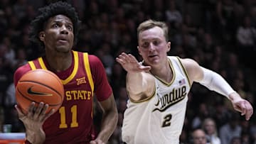 Dec 6, 2025; West Lafayette, Indiana, USA; Iowa State Cyclones guard Dominick Nelson (11) dribbles past Purdue Boilermakers guard  Fletcher Loyer (2) during the first half at Mackey Arena. Mandatory Credit: Jacob Musselman-Imagn Images