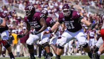Sep 18, 2021; College Station, Texas, USA; Texas A&M Aggies offensive lineman Kenyon Green (55) and offensive lineman Bryce Foster (61) in action during the game between the Texas A&M Aggies and the New Mexico Lobos at Kyle Field. Mandatory Credit: Jerome Miron-USA TODAY Sports