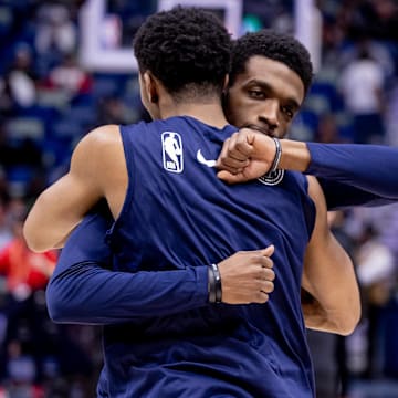 Feb 23, 2024; New Orleans, Louisiana, USA;  New Orleans Pelicans guard Trey Murphy III (25) hugs forward Herbert Jones (5)  during the first half against the Miami Heat at Smoothie King Center.