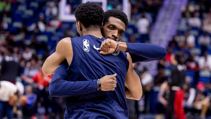 Feb 23, 2024; New Orleans, Louisiana, USA;  New Orleans Pelicans guard Trey Murphy III (25) hugs forward Herbert Jones (5)  during the first half against the Miami Heat at Smoothie King Center.