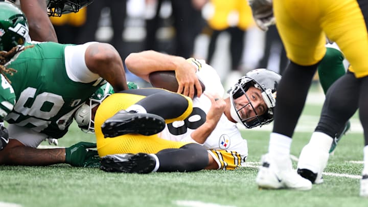 Steelers quarterback Aaron Rodgers was sacked four times in his debut. Steelers quarterback Aaron Rodgers was sacked four times in his debut.