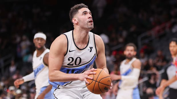 March 23, 2025; Atlanta, Georgia, United States; Atlanta striker Hawks Georges Niang (20) goes to the basket against the Philadelphia 7
