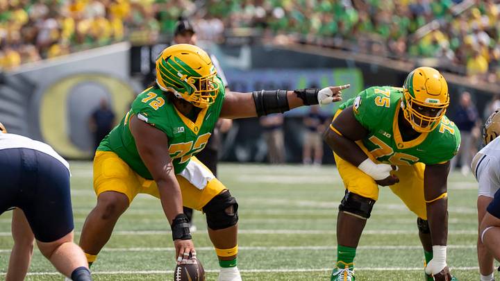 Oregon offensive linemen Iapani Laloulu, left, and Emmanuel Pregnon line up as the Oregon Ducks host the Montana State Bobcats on Aug. 30, 2025, at Autzen Stadium in Eugene, Oregon.