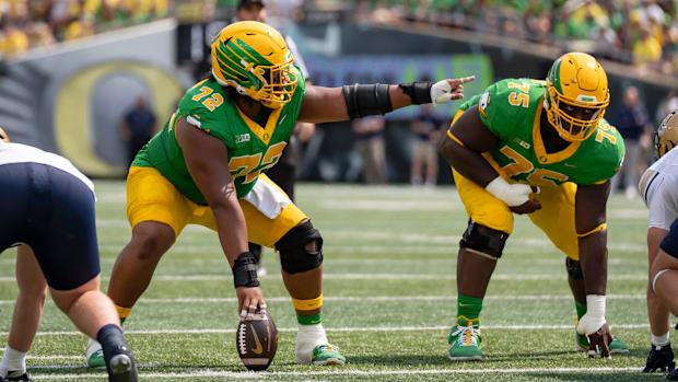 Oregon offensive linemen Iapani Laloulu, left, and Emmanuel Pregnon line up as the Oregon Ducks host the Montana State Bobcat