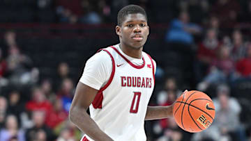 Nov 21, 2024; Spokane, Washington, USA; Washington State Cougars guard Cedric Coward (0) controls the ball against the Eastern Washington Eagles in the second half at Spokane Veterans Memorial Arena. Mandatory Credit: James Snook-Imagn Images