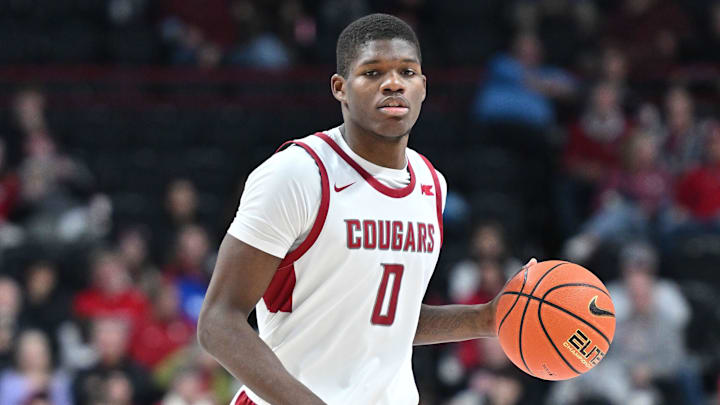 Nov 21, 2024; Spokane, Washington, USA; Washington State Cougars guard Cedric Coward (0) controls the ball against the Eastern Washington Eagles in the second half at Spokane Veterans Memorial Arena. Mandatory Credit: James Snook-Imagn Images