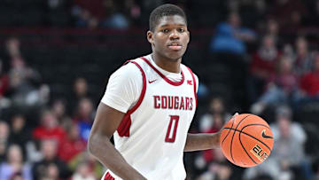Nov 21, 2024; Spokane, Washington, USA; Washington State Cougars guard Cedric Coward (0) controls the ball against the Eastern Washington Eagles in the second half at Spokane Veterans Memorial Arena. Mandatory Credit: James Snook-Imagn Images