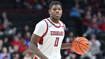 Nov 21, 2024; Spokane, Washington, USA; Washington State Cougars guard Cedric Coward (0) controls the ball against the Eastern Washington Eagles in the second half at Spokane Veterans Memorial Arena. Mandatory Credit: James Snook-Imagn Images